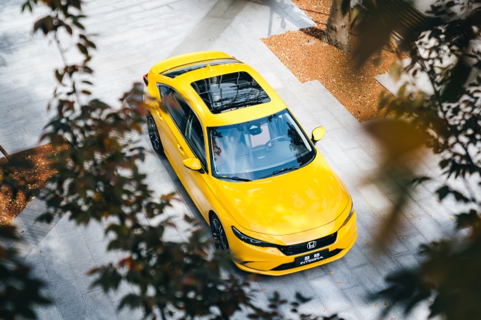 Yellow Honda Integra parked outdoors