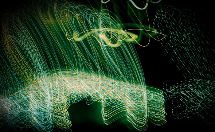 Abstract light trails in green and yellow