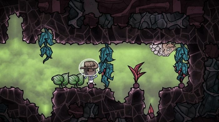 Oxygen Not Included character in a cave with plants