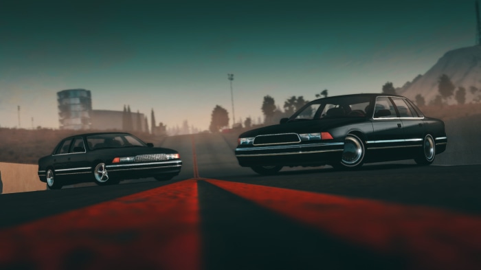Two black sedans on a road in BeamNG.drive