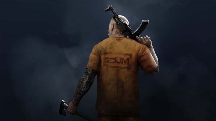 Man with SCUM logo shirt holding rifle and axe