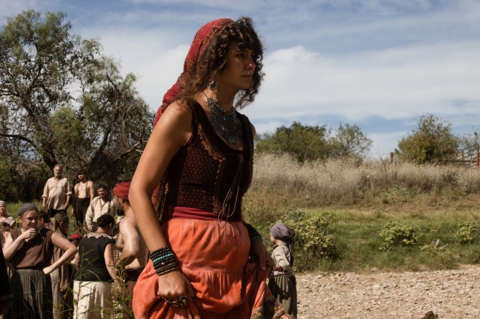 Woman in traditional clothing with a group of people