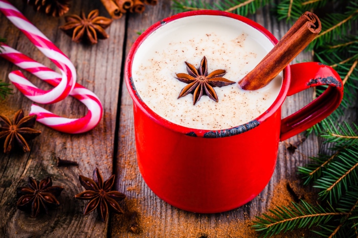 Hot Chocolate in a Red Mug with Christmas Decorations