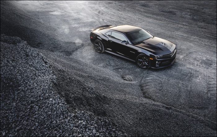 Black Chevrolet Camaro ZL1 on gravel