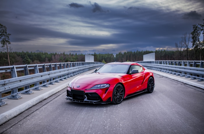 Red Toyota Supra on a Bridge