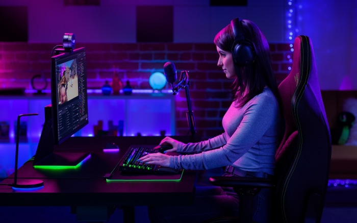 Woman gamer streaming with headphones and microphone