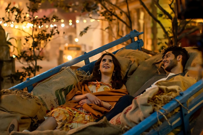 Laura Marano and Mena Massoud in The Royal Treatment