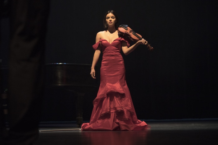 Lucy Hale with a violin on stage