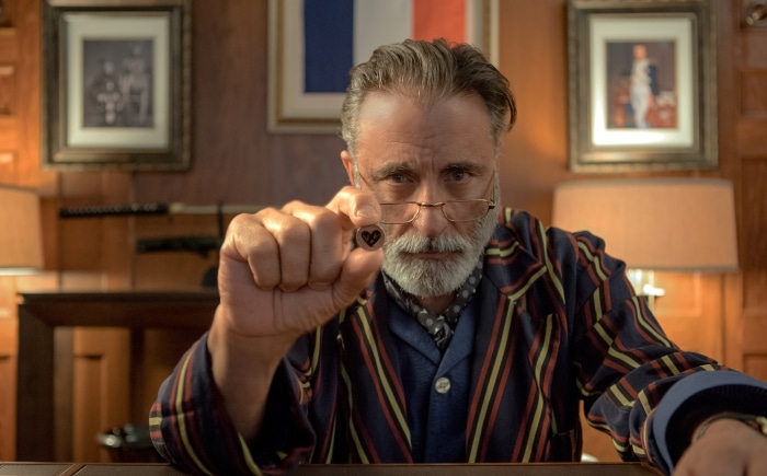 Andy Garcia holding a heart token