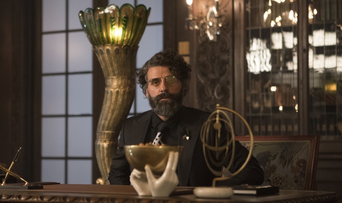 Oscar Isaac in a dark suit