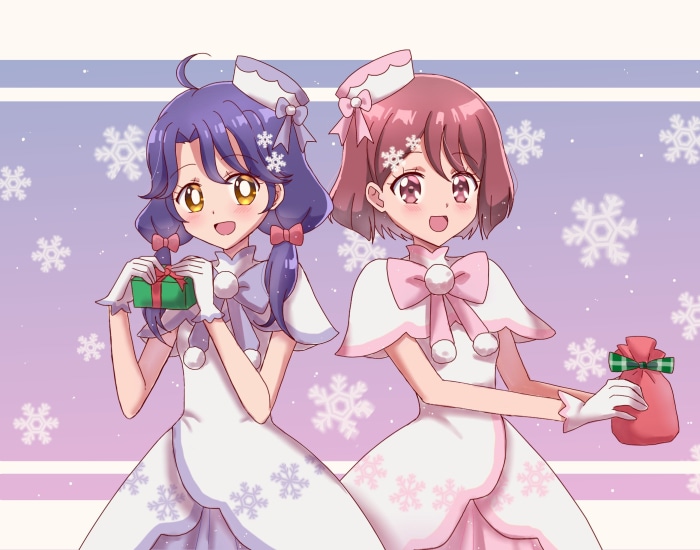 Two girls in winter outfits with gifts