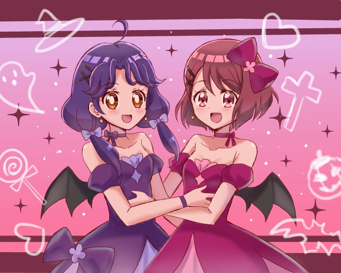 Two girls in Halloween costumes