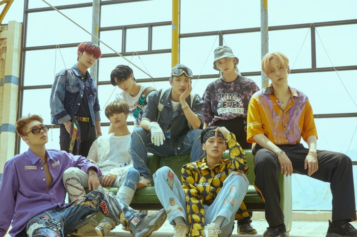 ATEEZ members posing for a group photo