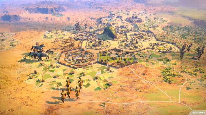 Humankind city and cavalry in desert landscape