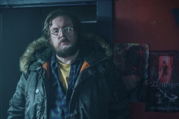Steve Agee as John Economos in Peacemaker