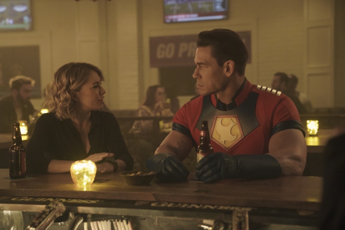 Peacemaker and Emilia Harcourt at a bar