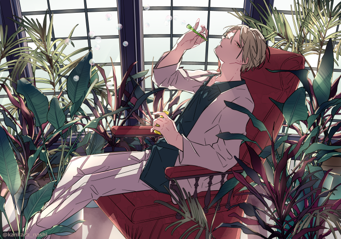 Boy blowing bubbles in a greenhouse 4K