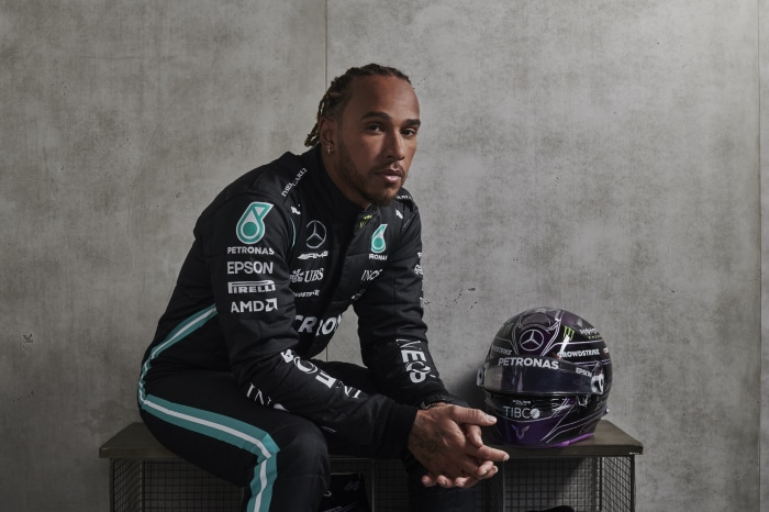 Lewis Hamilton in Mercedes racing suit with helmet