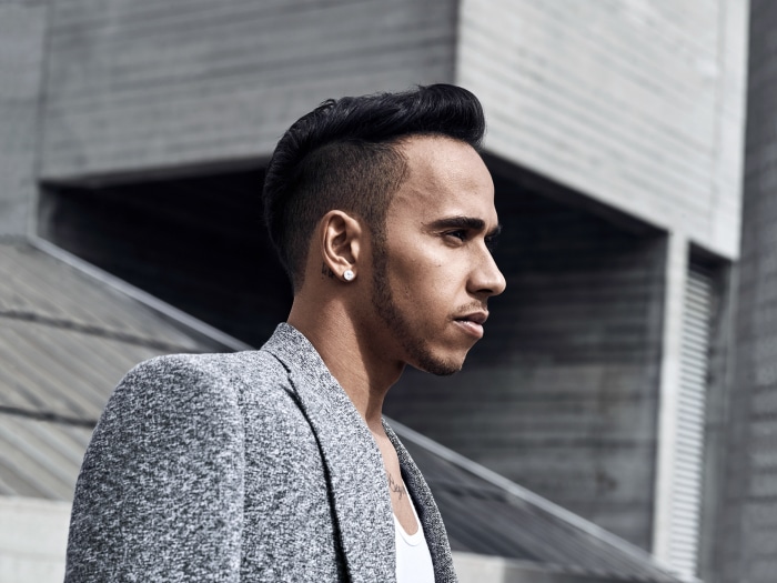 Lewis Hamilton wearing a grey blazer