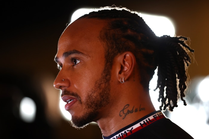Lewis Hamilton with 'God is love' tattoo