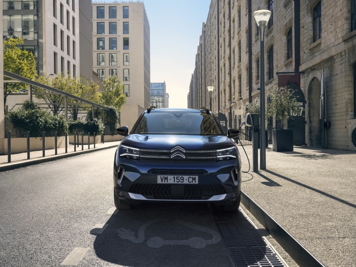 Citroen C5 Aircross SUV charging on a city street