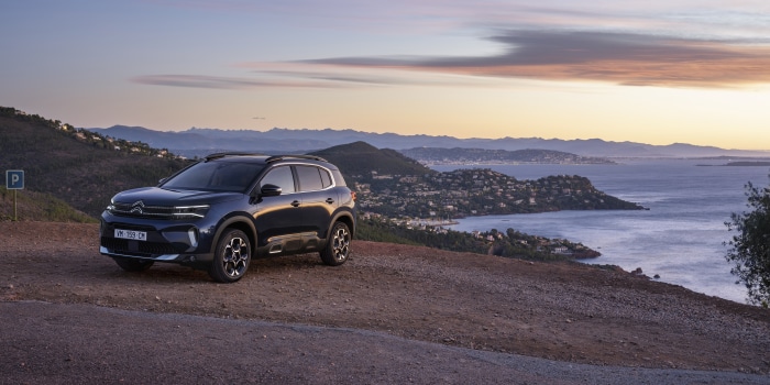 Citroen C5 Aircross SUV parked on a hill overlooking the sea