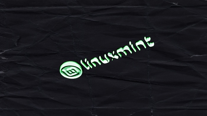 Linux Mint logo on crumpled paper