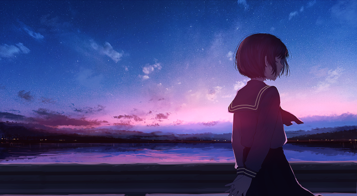 Girl in school uniform by the water at sunset