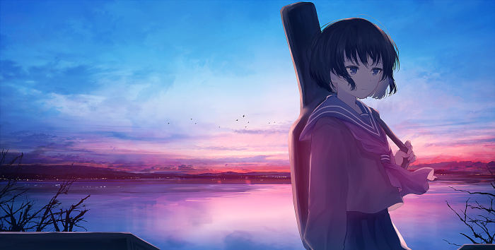 Girl with guitar case at sunset