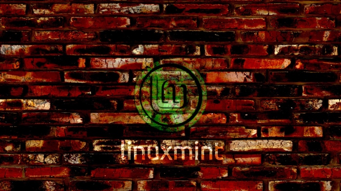 Linux Mint logo on brick wall