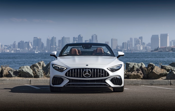 White Mercedes-AMG SL Cabriolet in front of San Diego skyline