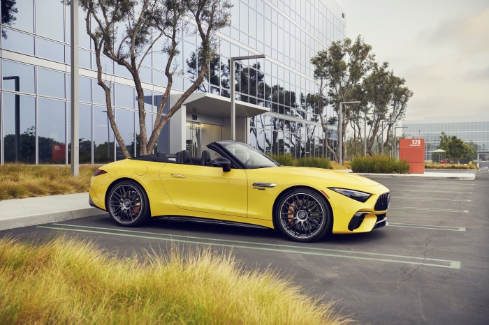 Yellow Mercedes-AMG SL Cabriolet parked outside office building
