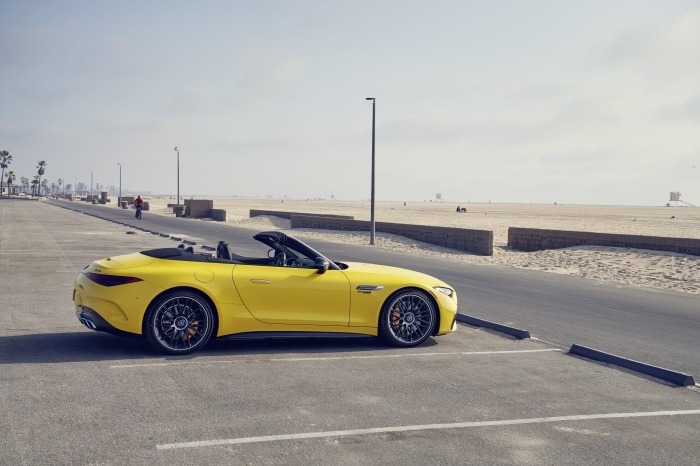 Yellow Mercedes-AMG SL Cabriolet parked by the beach