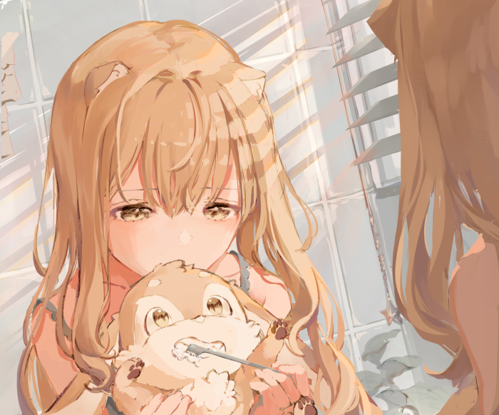 Girl brushing a stuffed animal's teeth