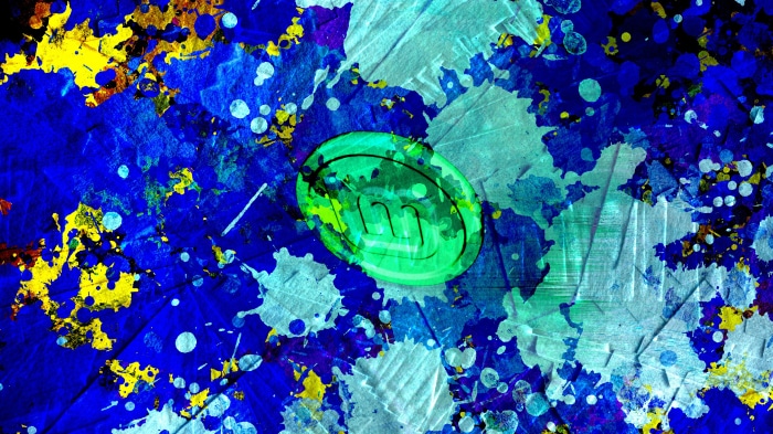Linux Mint logo on abstract paint splatter background