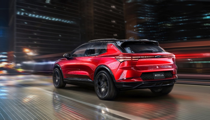 2024 Chevrolet Equinox EV driving at night