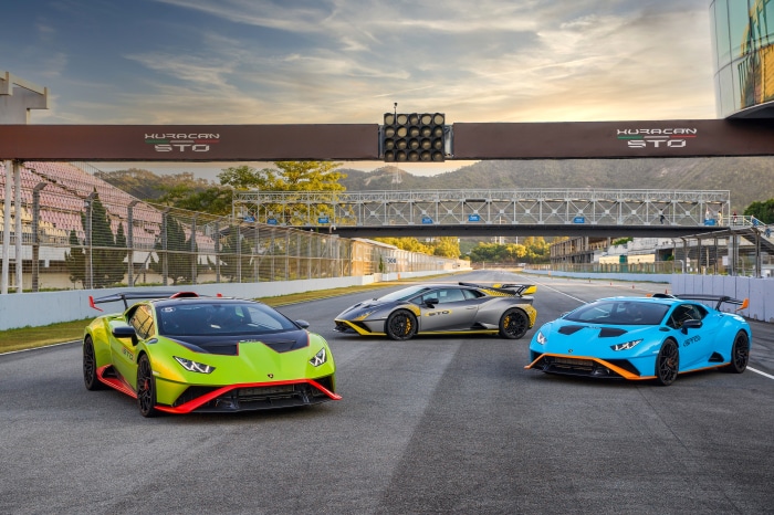 Three Lamborghini Huracan STO cars on a racetrack