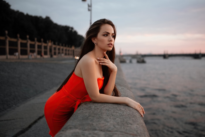 Woman in Red Dress by the Water