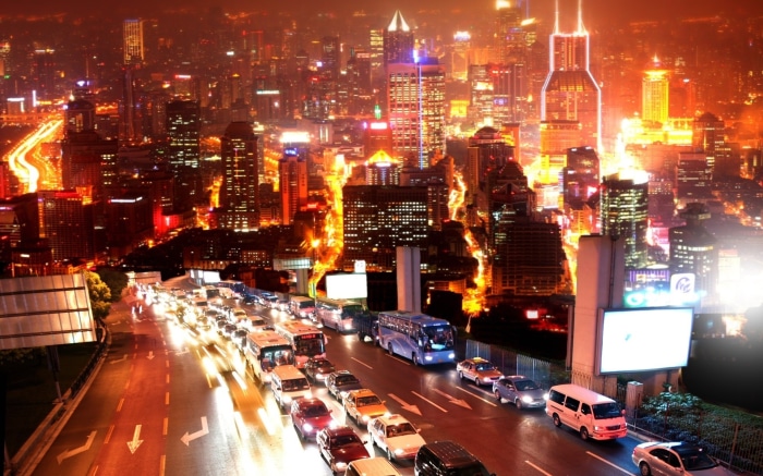 Shanghai city skyline at night with traffic