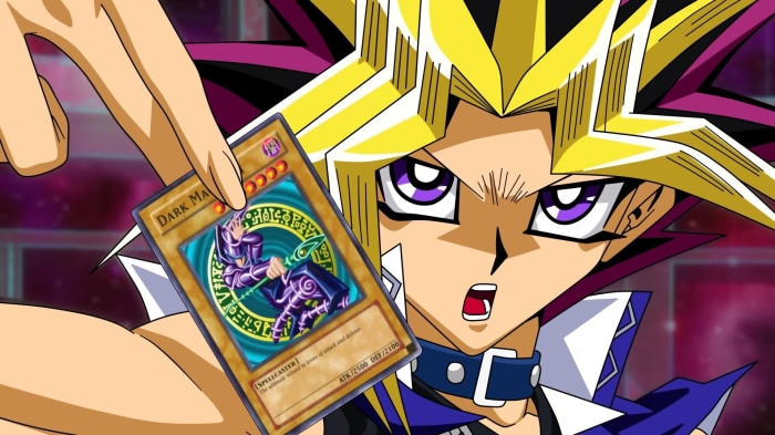 Yugi Muto holding Dark Magician card from Yu-Gi-Oh!