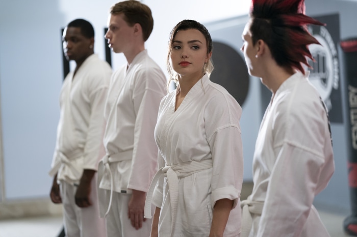 Tory Nichols and other Cobra Kai students in a dojo