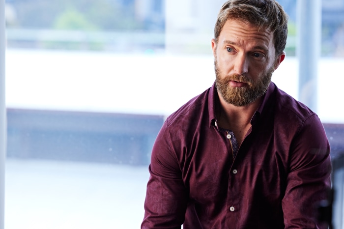 Tim Draxl in a maroon shirt