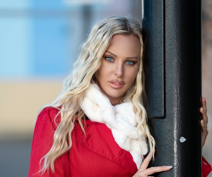 Woman with blonde hair and blue eyes