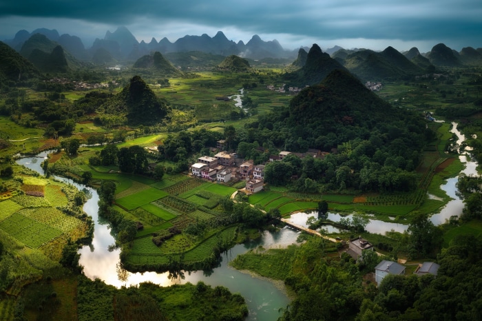 Karst landscape with river and village in China