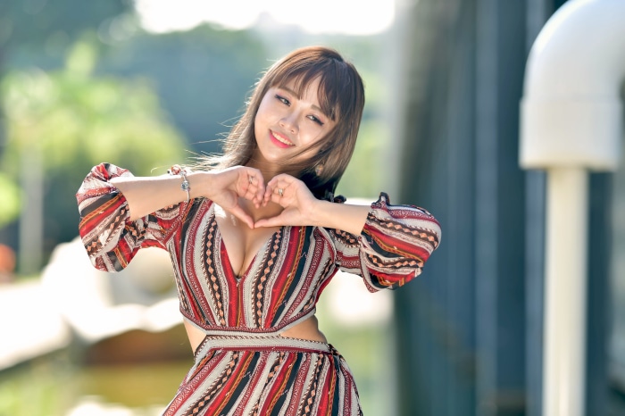 Asian Woman Making Heart Gesture