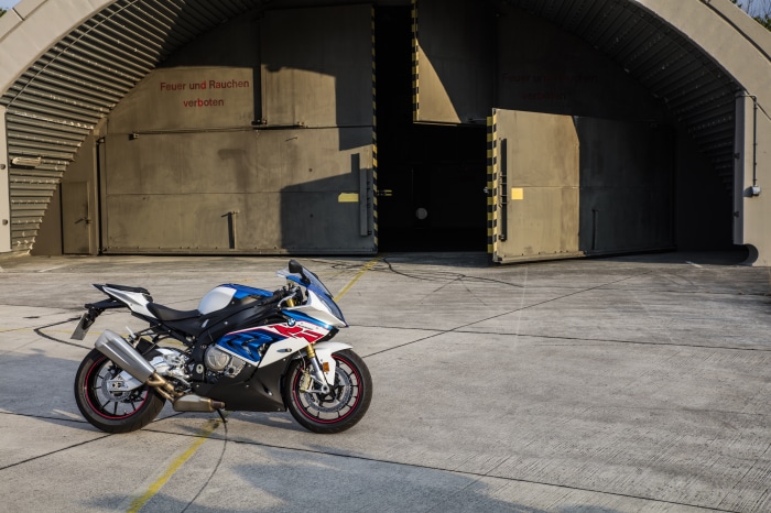 BMW S1000RR motorcycle in front of hangar