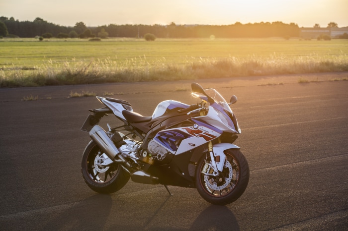 BMW S1000RR motorcycle on asphalt at sunset