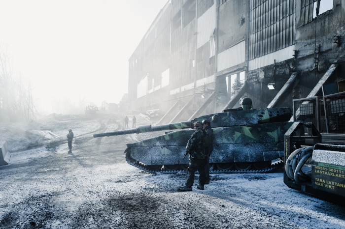 Soldiers and Tank in Snowy Industrial Area 4K