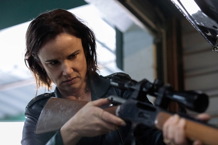 Woman aiming a rifle in Yellowjackets 4K