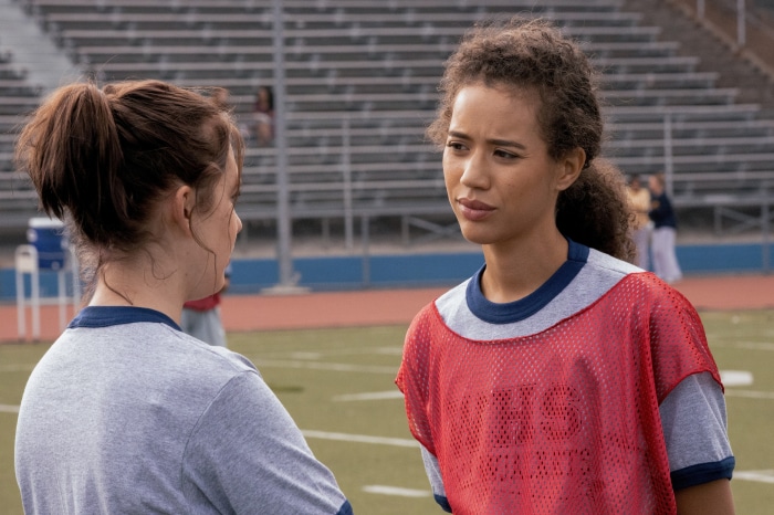 Two girls on a football field
